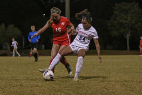 Women playing soccer